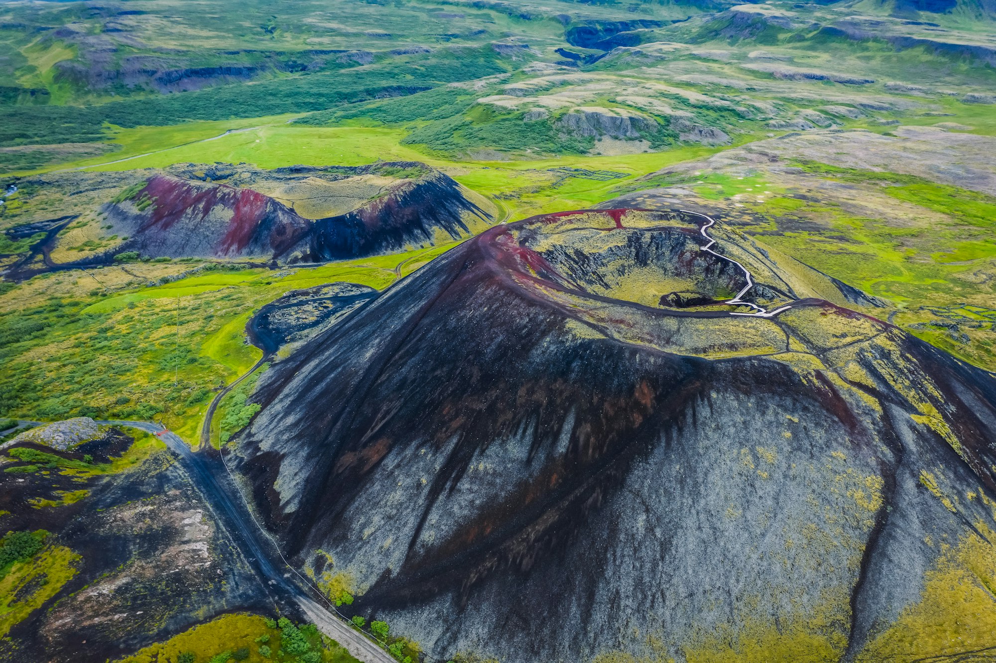 Aerial panoramic views of Grabrok volcano and lava valley from in Iceland