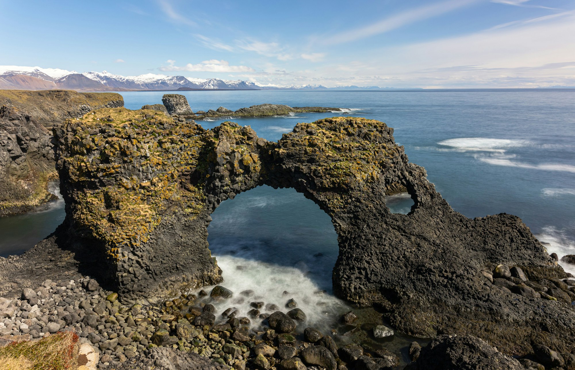 Long exposure shot of Arnarstapi cliff on Snaefellsnes Peninsula in Iceland